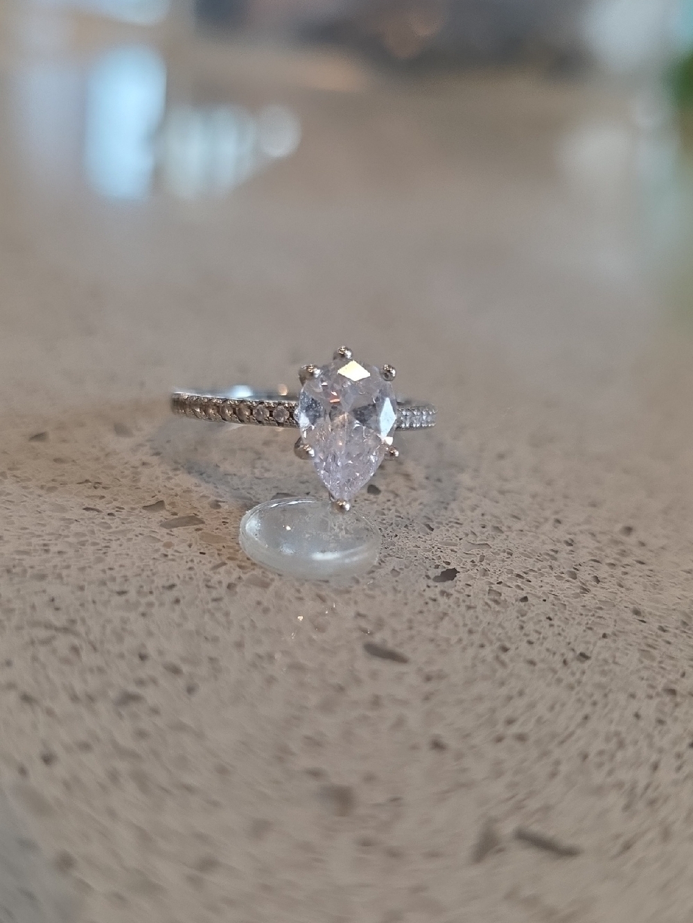 Elegant Pear-Cut Silver Engagement Ring with Clear Stone